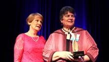 Dr. Gilbert receiving the 2019 ATHENA award