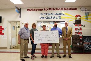 MNS receives check for grant. 