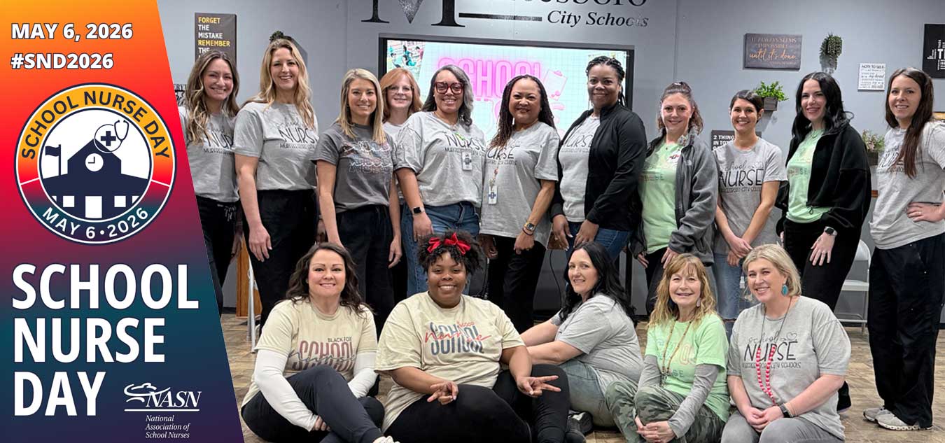 District nurses all pose together for School Nurse Day.